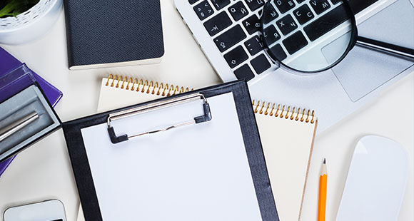 workspace with clipboard notebooks and magnifying glass for productivity and organization 2 tasks and notes